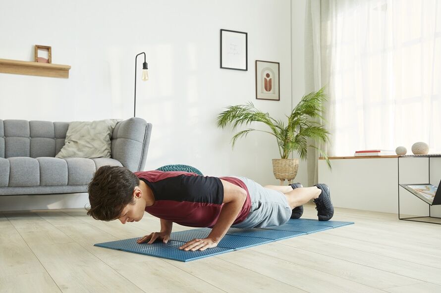 Stand in a plank to work out your press and back muscles